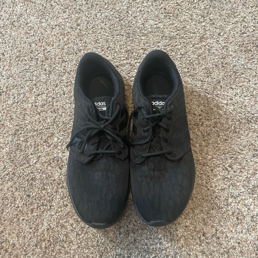 Black Adidas running shoes.